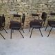 Brown faux leather armchairs