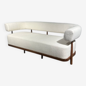 Rounded white sofa with wooden structure
