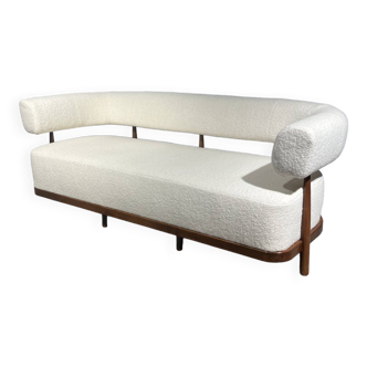 Rounded white sofa with wooden structure