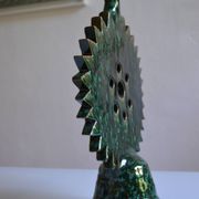 Green ceramic sun candlestick from Tamegroute, Morocco.
