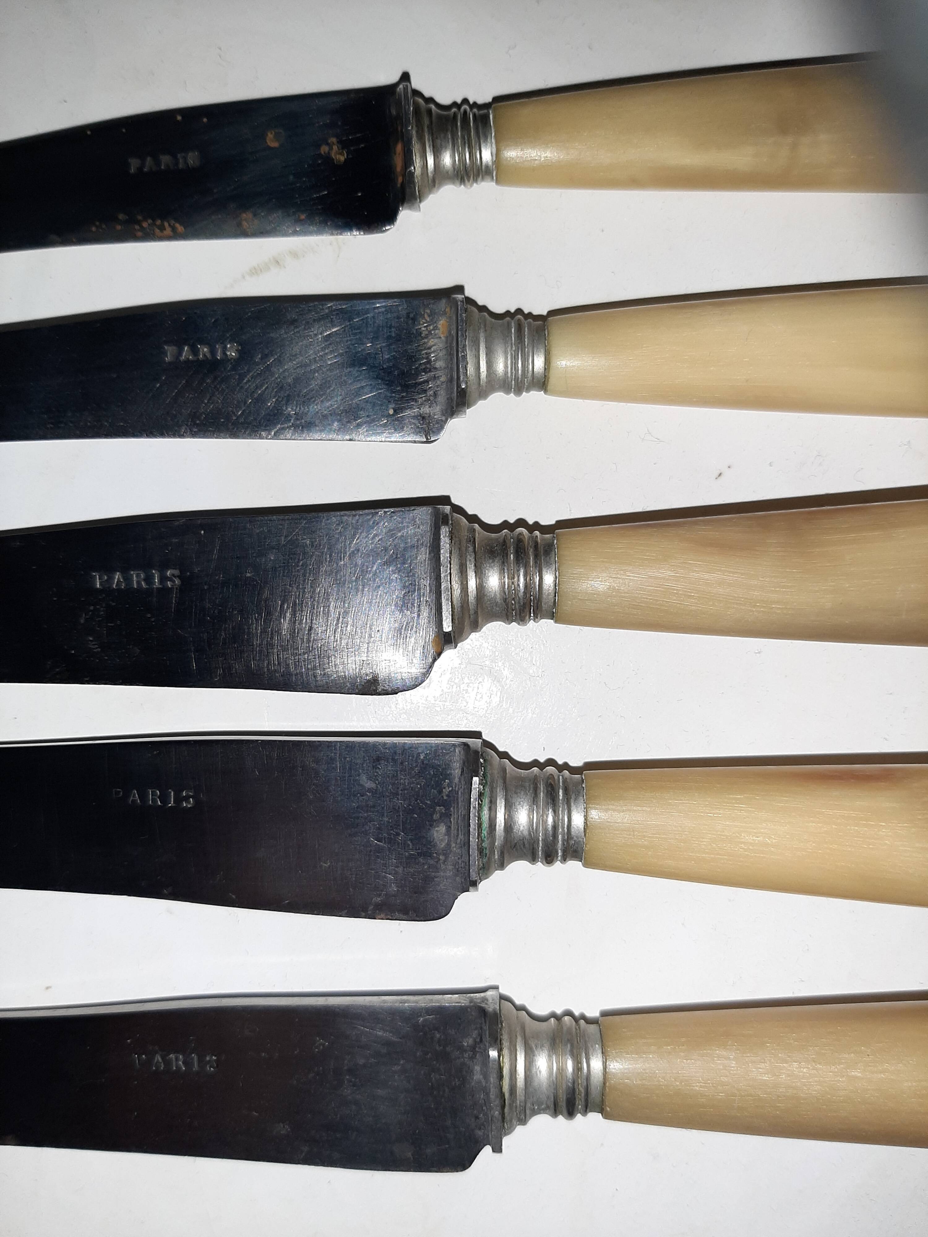 29-piece horn cutlery set, knives and serving utensils.