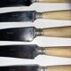 29-piece horn cutlery set, knives and serving utensils.