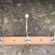 Large vintage wall coat rack with 5 brass and wood hooks – bistro