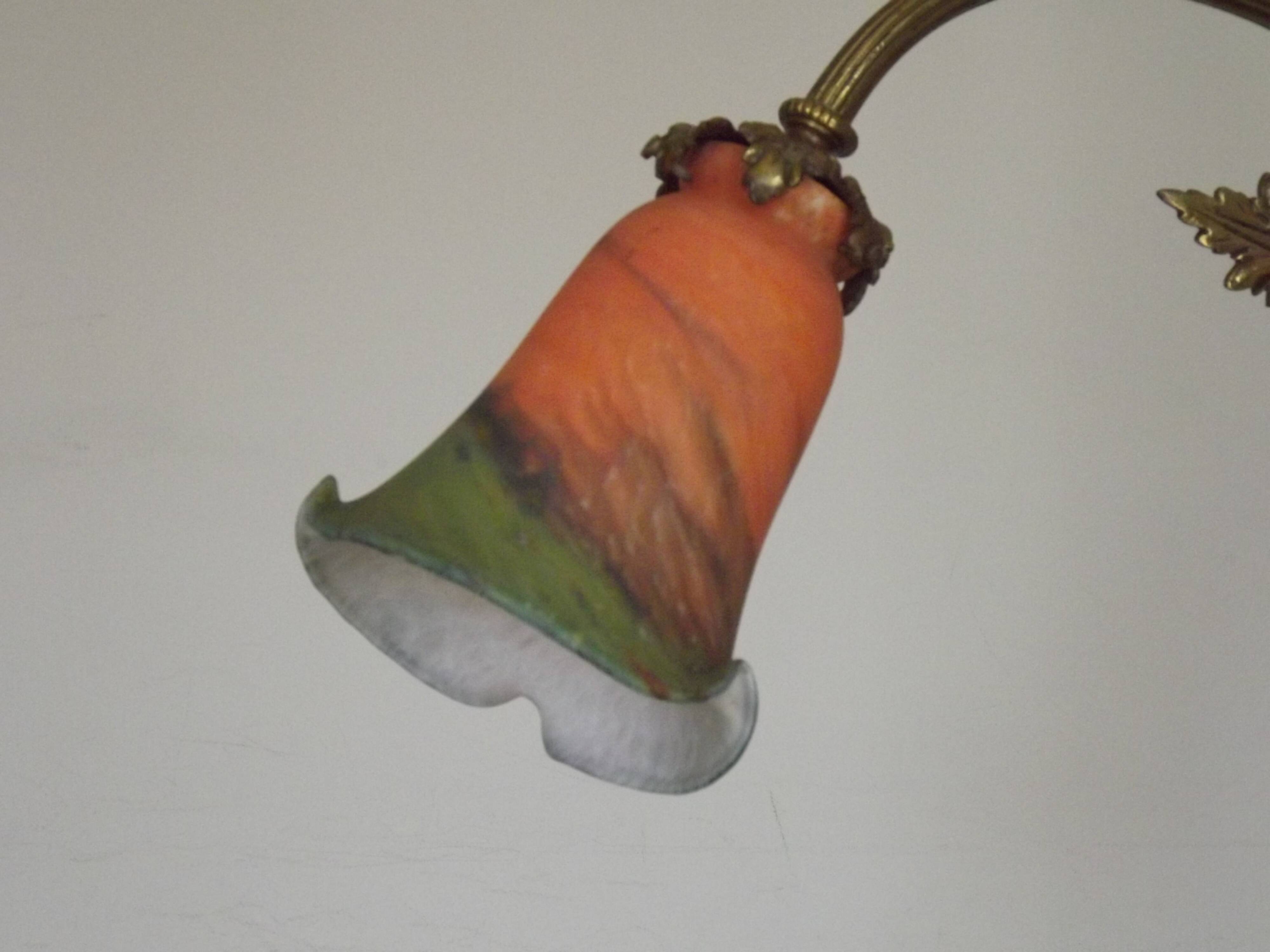 Art Nouveau three-light chandelier in bronze with orange and green glass shade, France.