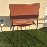 A pair of vintage brown Skaï chairs.