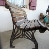 Small garden bench, with cast iron legs.