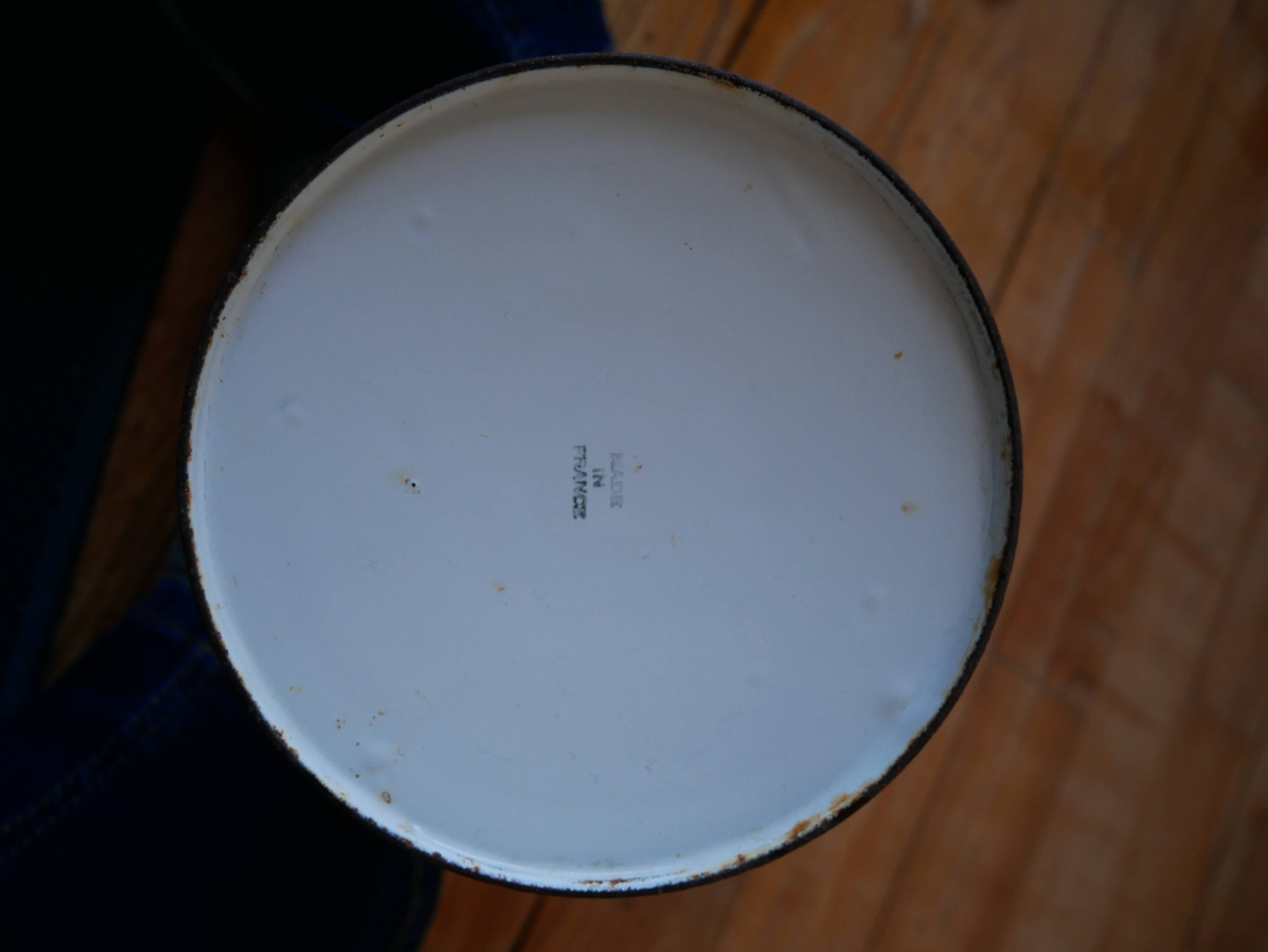 White enamelled metal broc