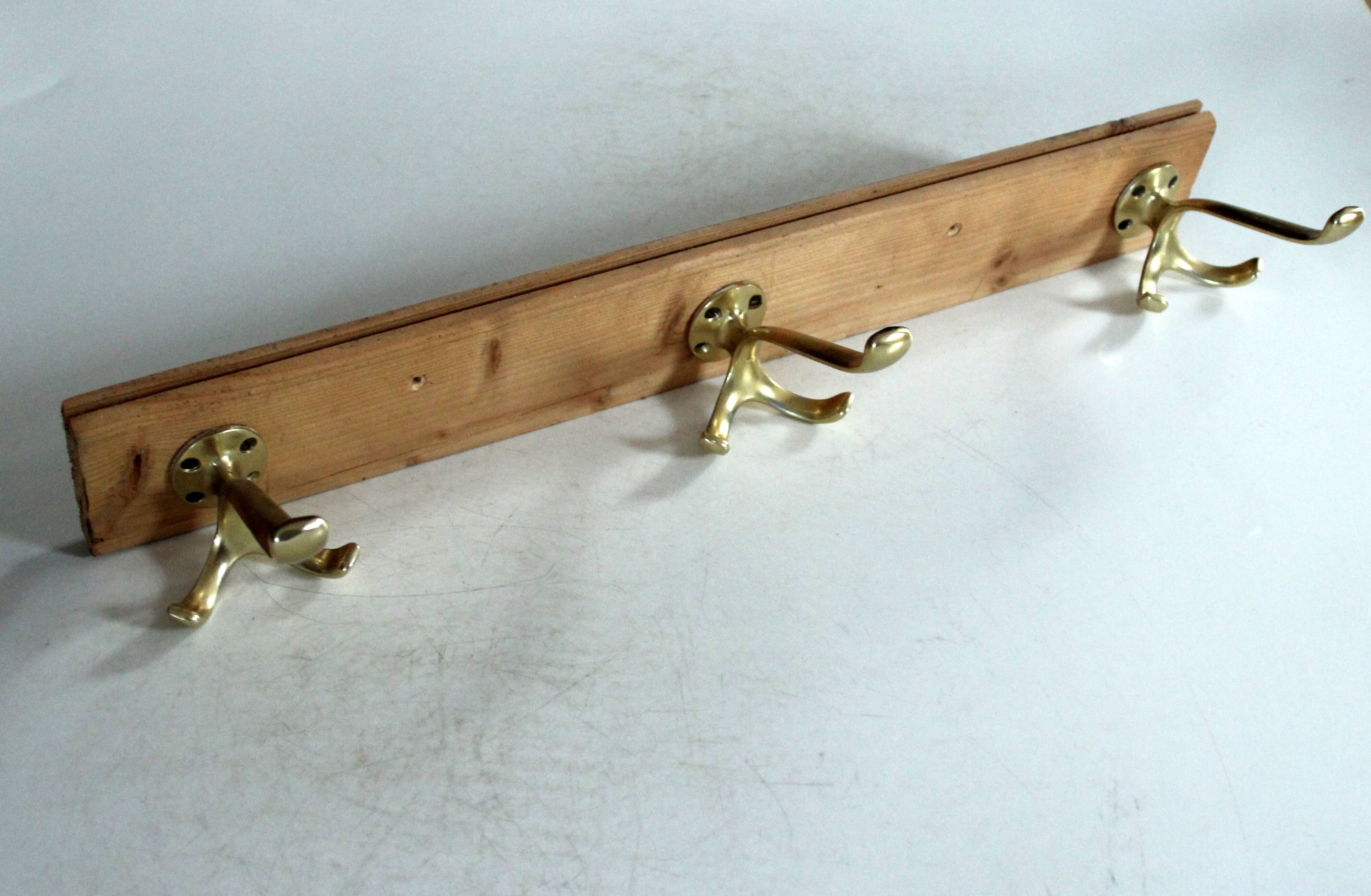 Wall mounted wooden coat rack with 3 brass hooks, vintage from the 50s