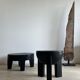 Black mango wood tripod side table with a semi-spherical top, height: 45 cm, diameter: 44 cm.