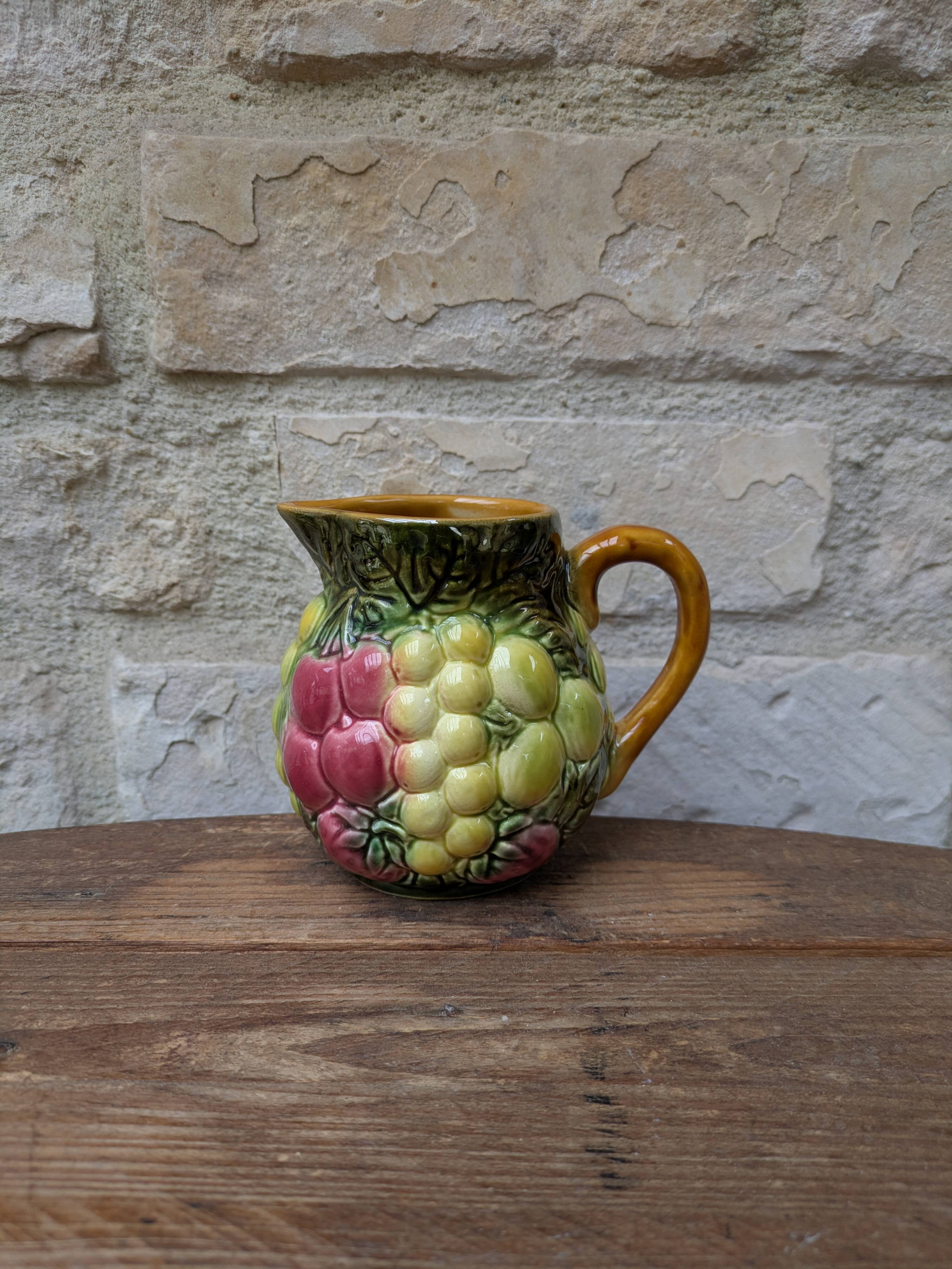 Small jug, milk pot in slipware with relief fruits Salins les Bains
