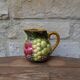 Small jug, milk pot in slipware with relief fruits Salins les Bains