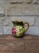 Small jug, milk pot in slipware with relief fruits Salins les Bains