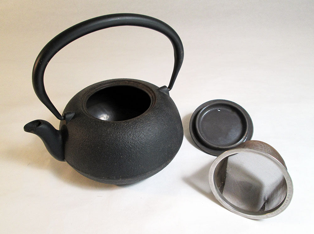Black cast iron teapot