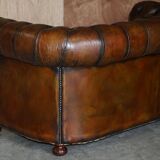 Restored leather Chesterfield sofa, walnut legs.
