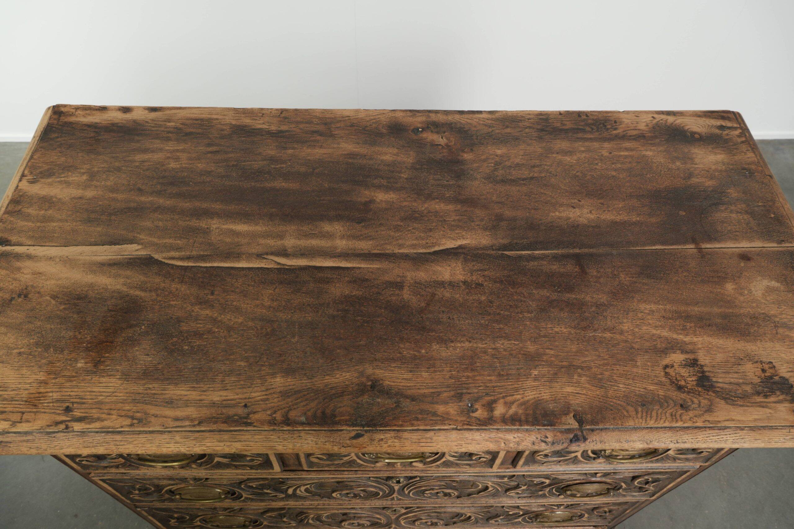 Richly carved English oak chest of drawers from the 18th century