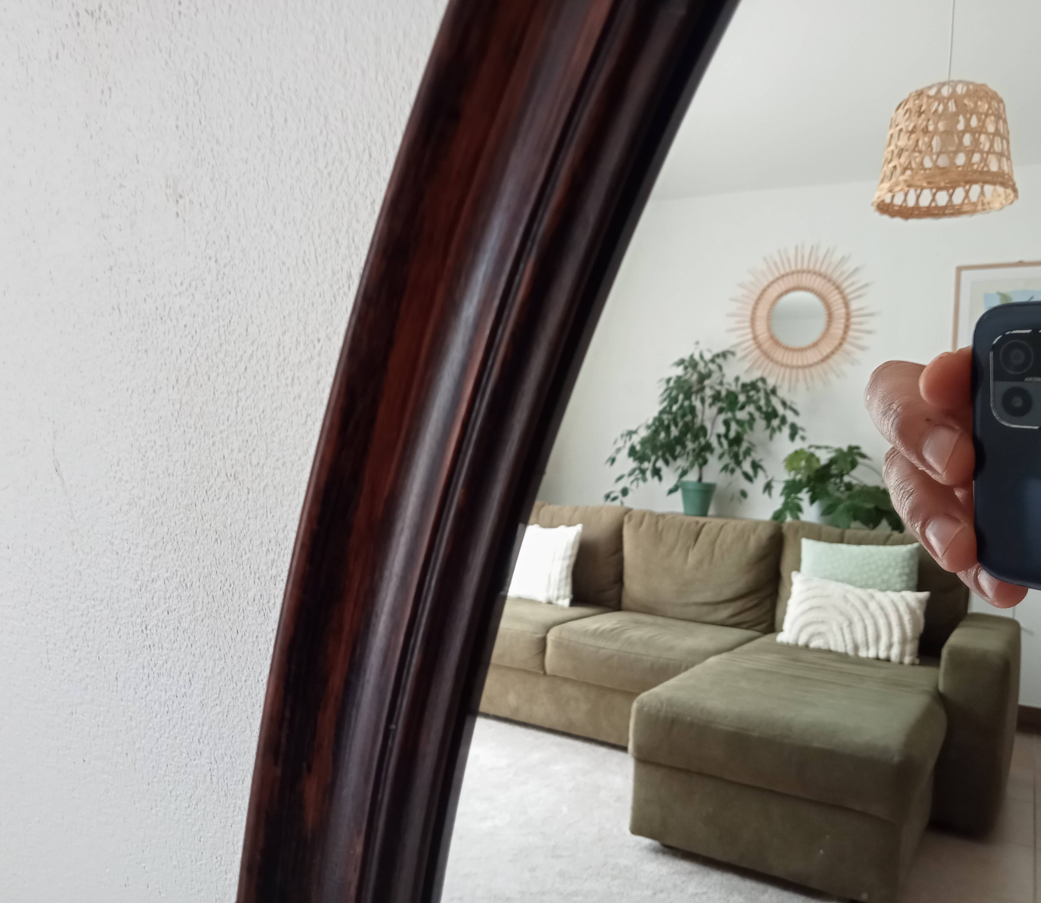 Oval antique mirror in solid wood from the 1960s.