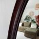 Oval antique mirror in solid wood from the 1960s.
