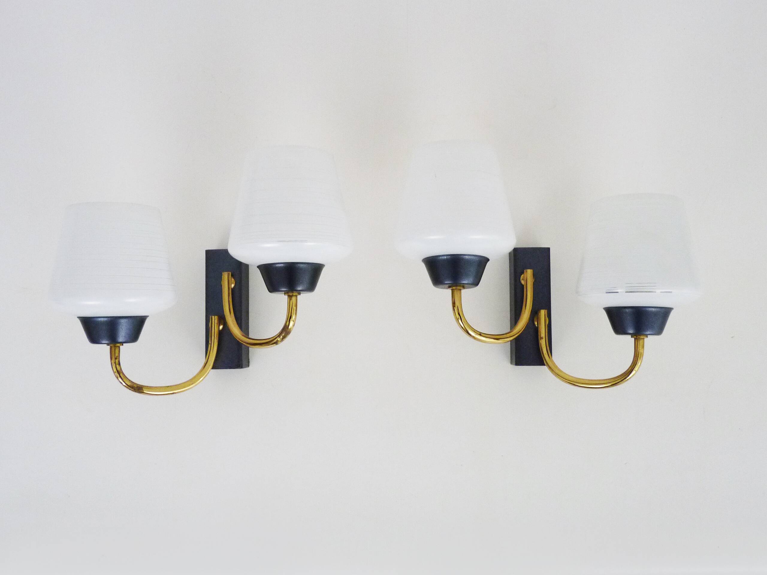 Pair of vintage Maison Arlus wall lights from the 1950s in brass, glass globe.