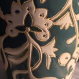 Blue water vase with white floral pattern