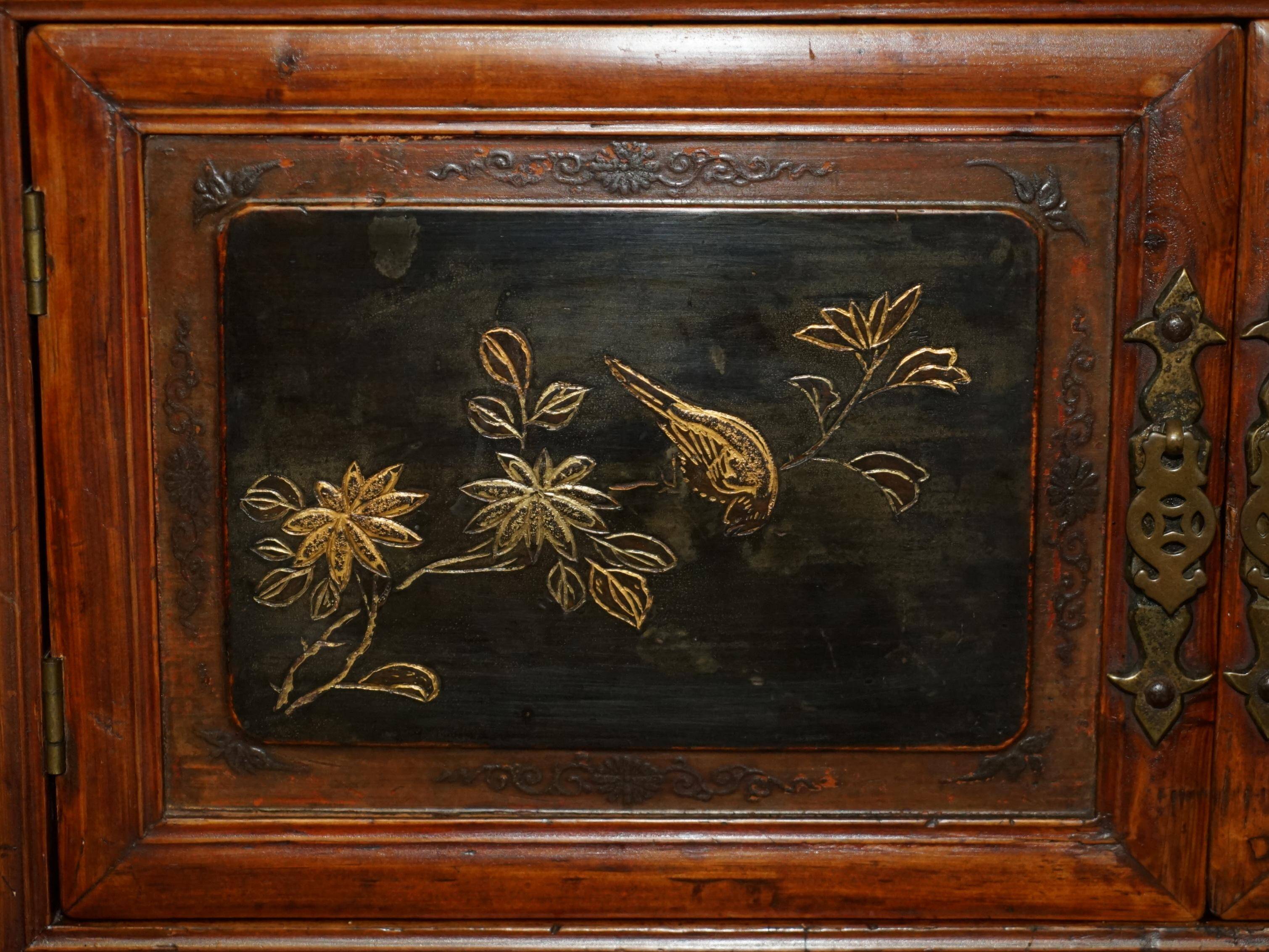 Antique Chinese armoire hand-carved around 1880 with country-style handles.