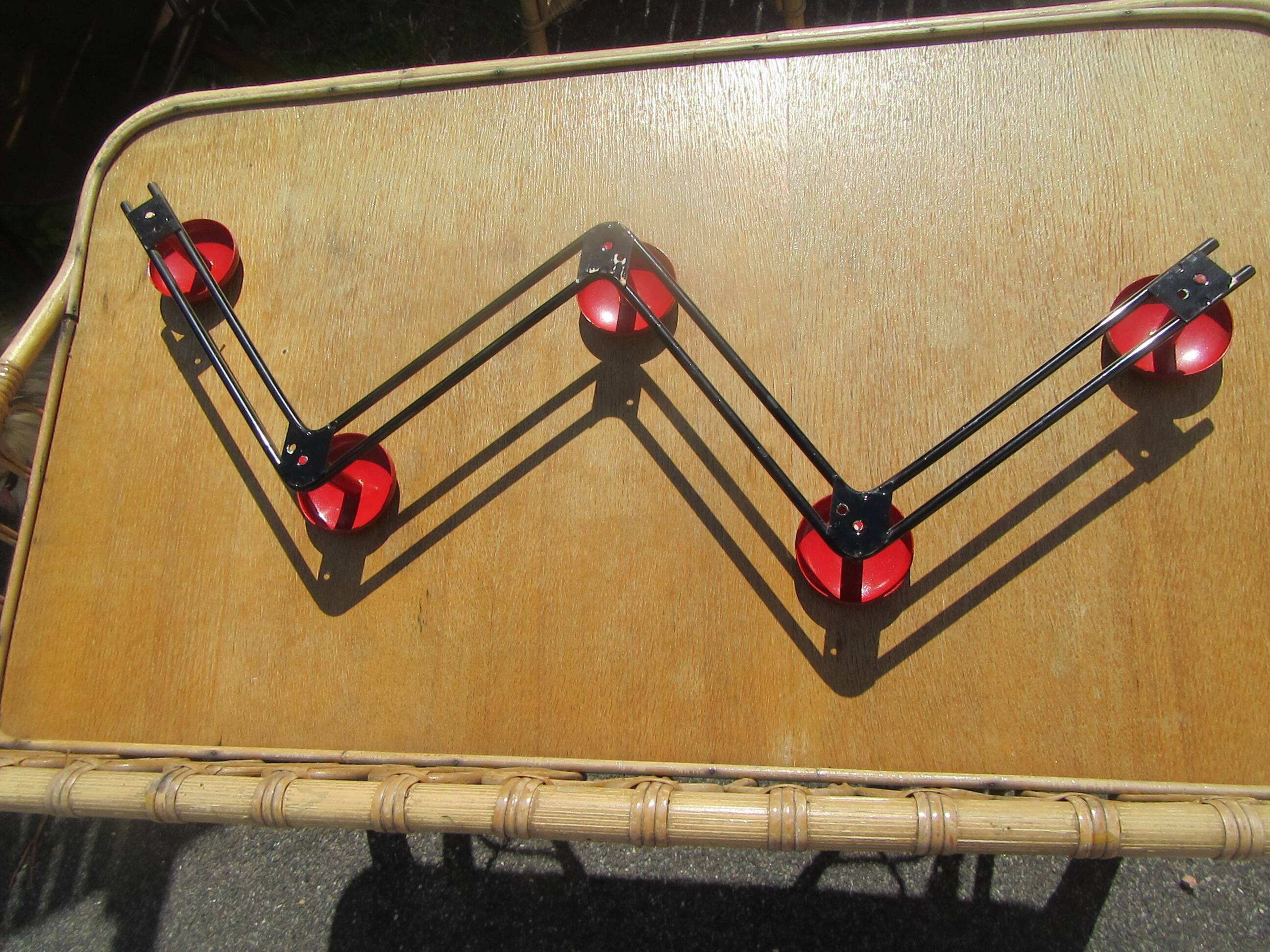 vintage black and red iron coat rack