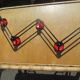 vintage black and red iron coat rack