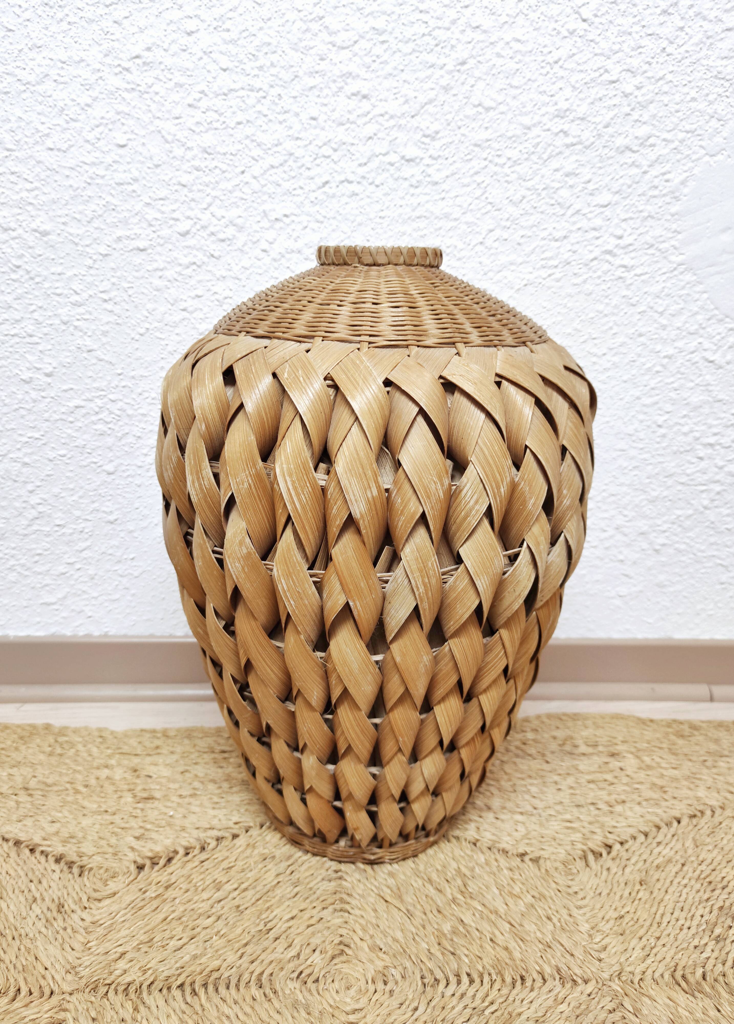 Vase in braided bamboo leaves