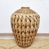 Vase in braided bamboo leaves