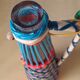 Bottle scoubidous conical
