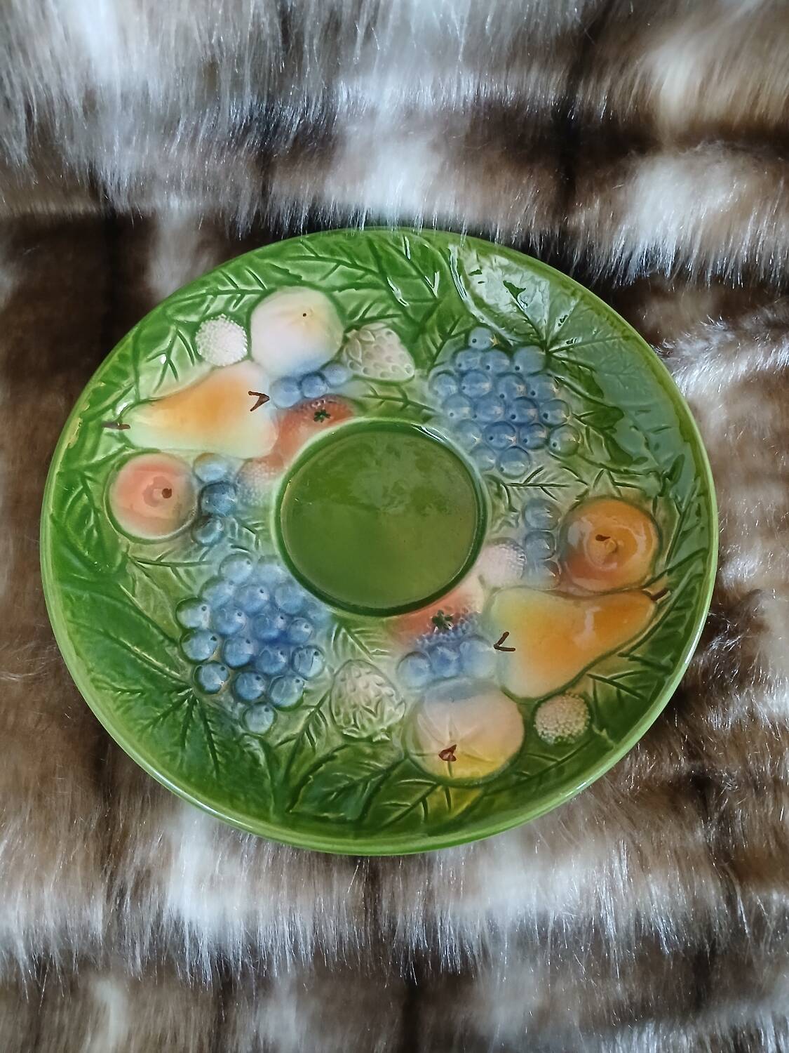 Antique cup and saucer in slipware.
