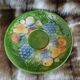 Antique cup and saucer in slipware.
