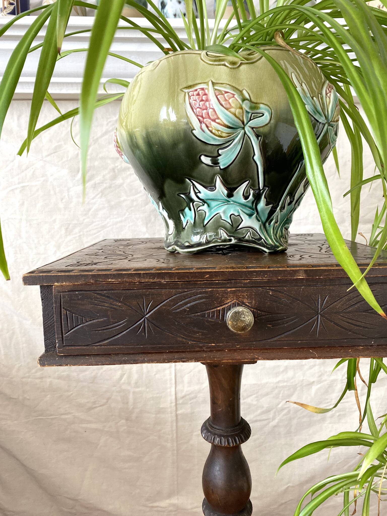 Large earthenware cache-pot in Art Nouveau style, decorated with thistles.