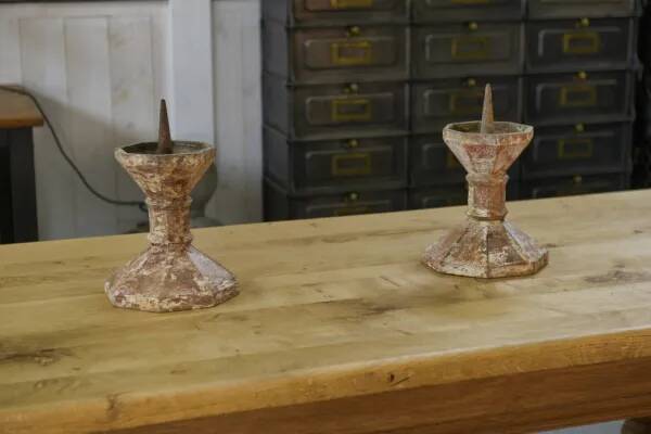 Pair of patinated cast iron candlesticks, 1940s