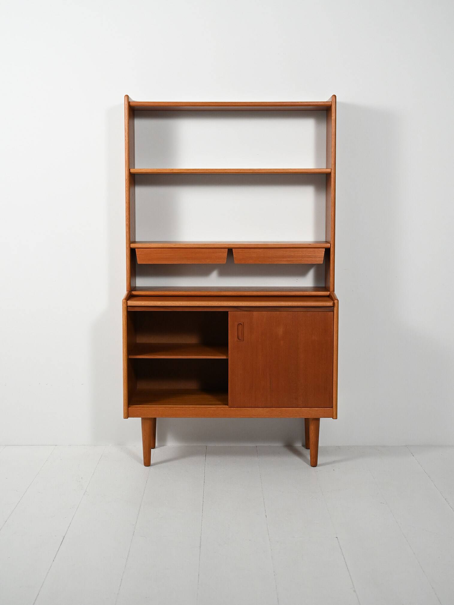 Scandinavian teak bookcase with suspended drawers