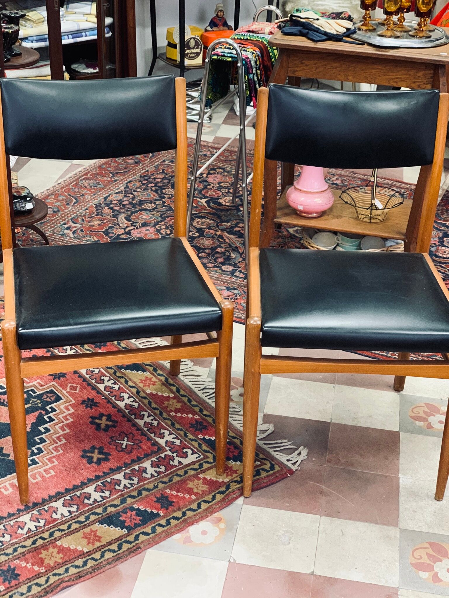 2 Scandinavian-style natural wood chairs, black trim