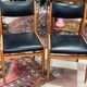 2 Scandinavian-style natural wood chairs, black trim