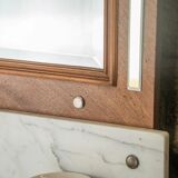 Antique washbasin cabinet from 1928 in wood and marble with a lighted mirror.