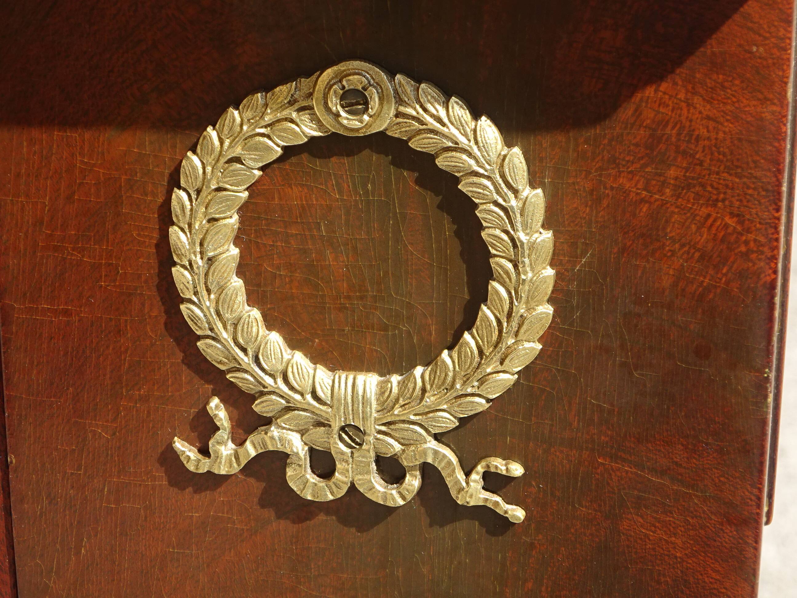 Flamed mahogany enfilade with sea green marble in Empire style.