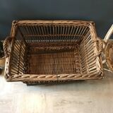 Rattan laundry basket on vintage wheels
