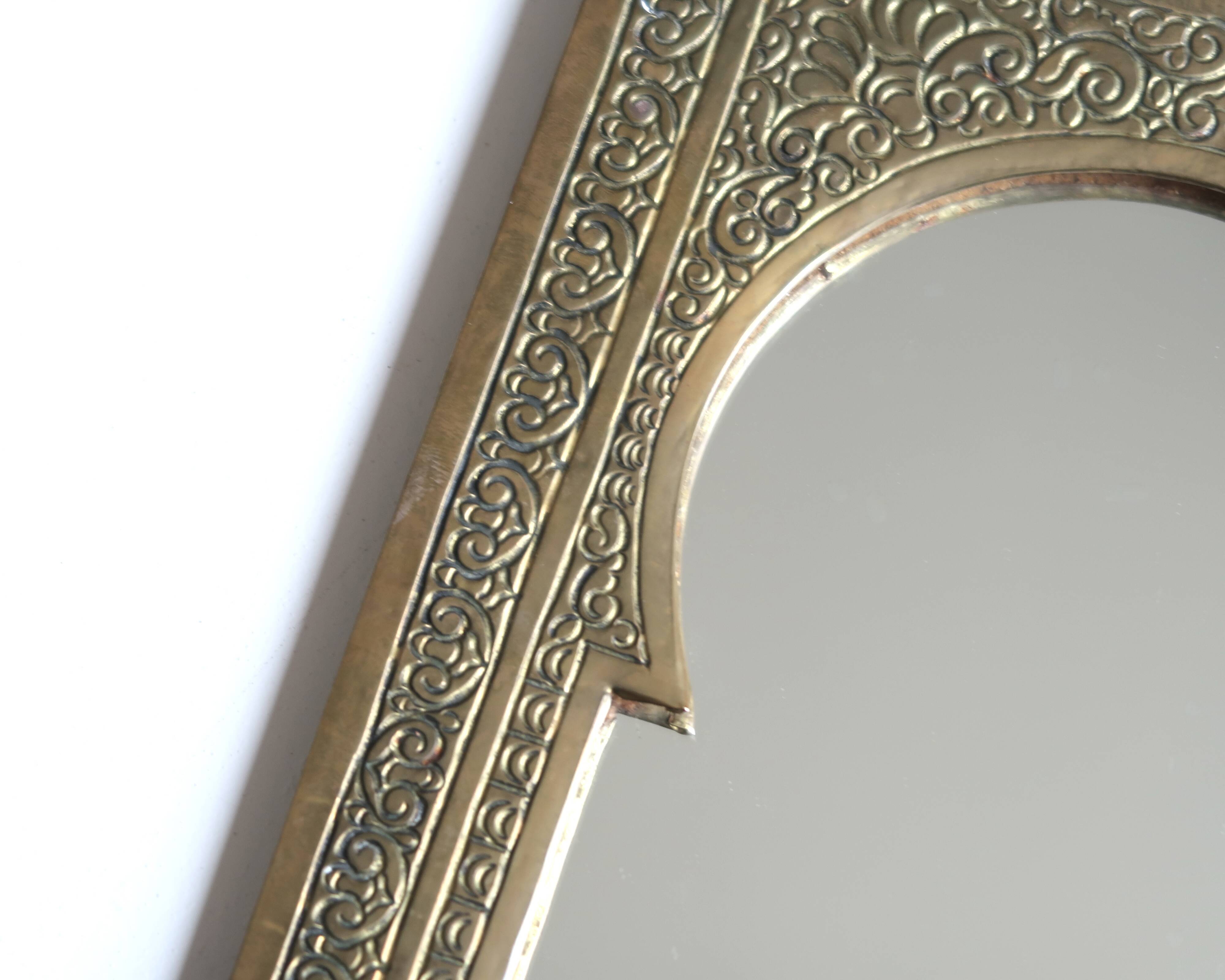 Rectangular Moroccan mirror in brass resembling a door, 1970s.