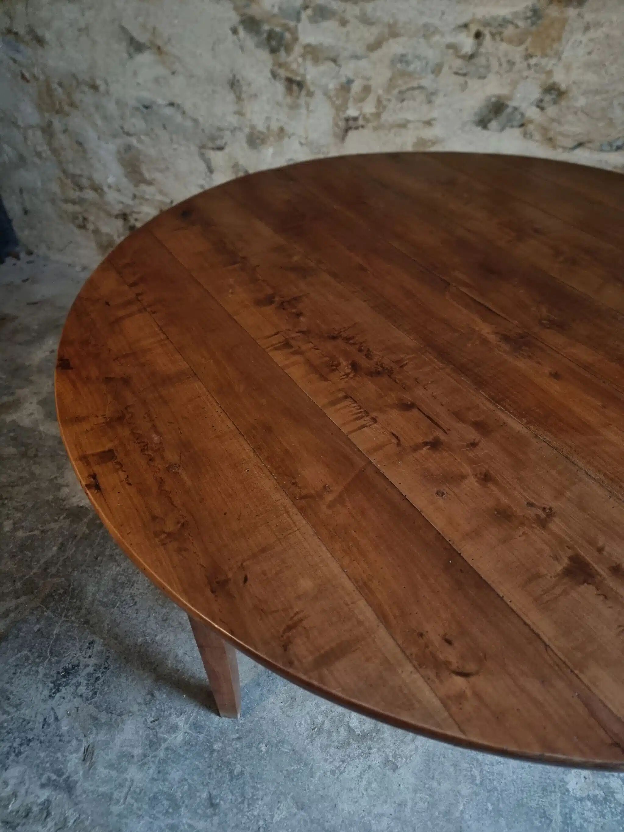 Antique round dining table in cherry wood, France, circa 1920.