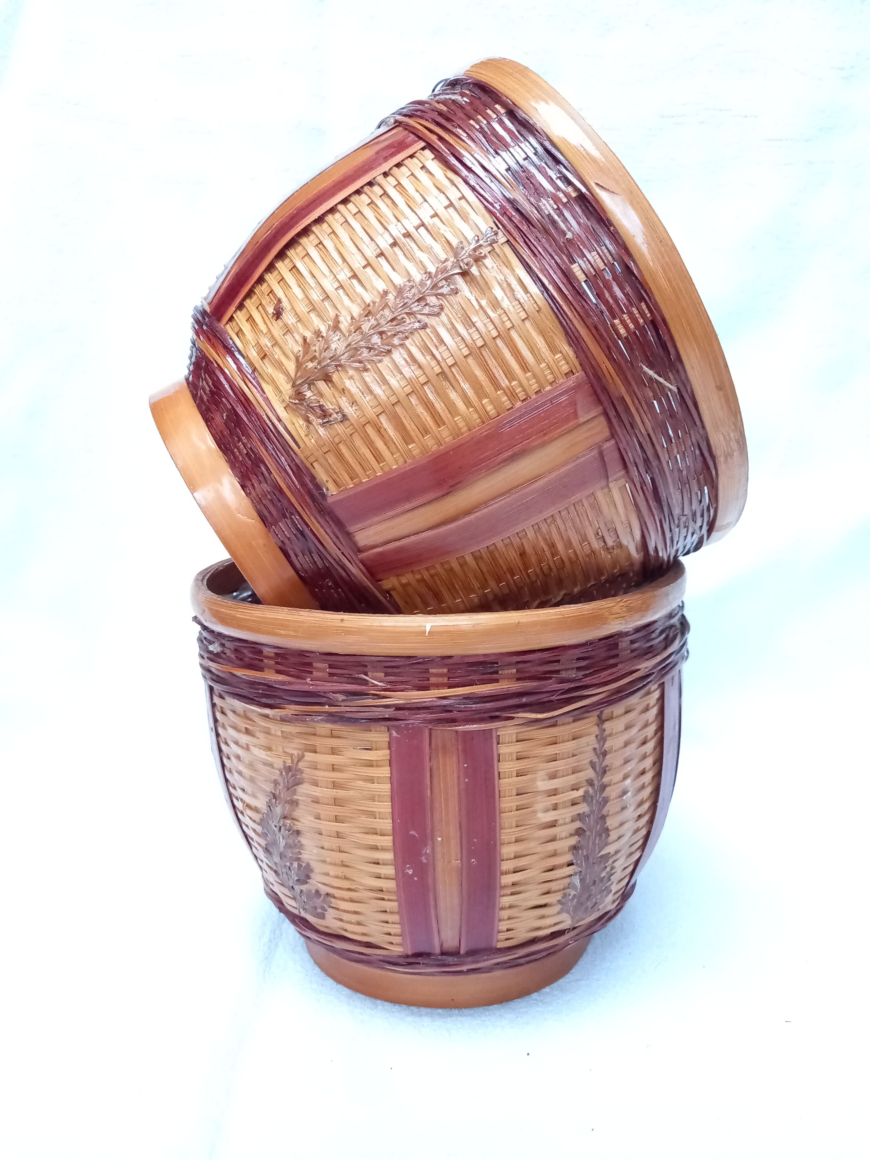Duo of vintage braided wicker pot cover