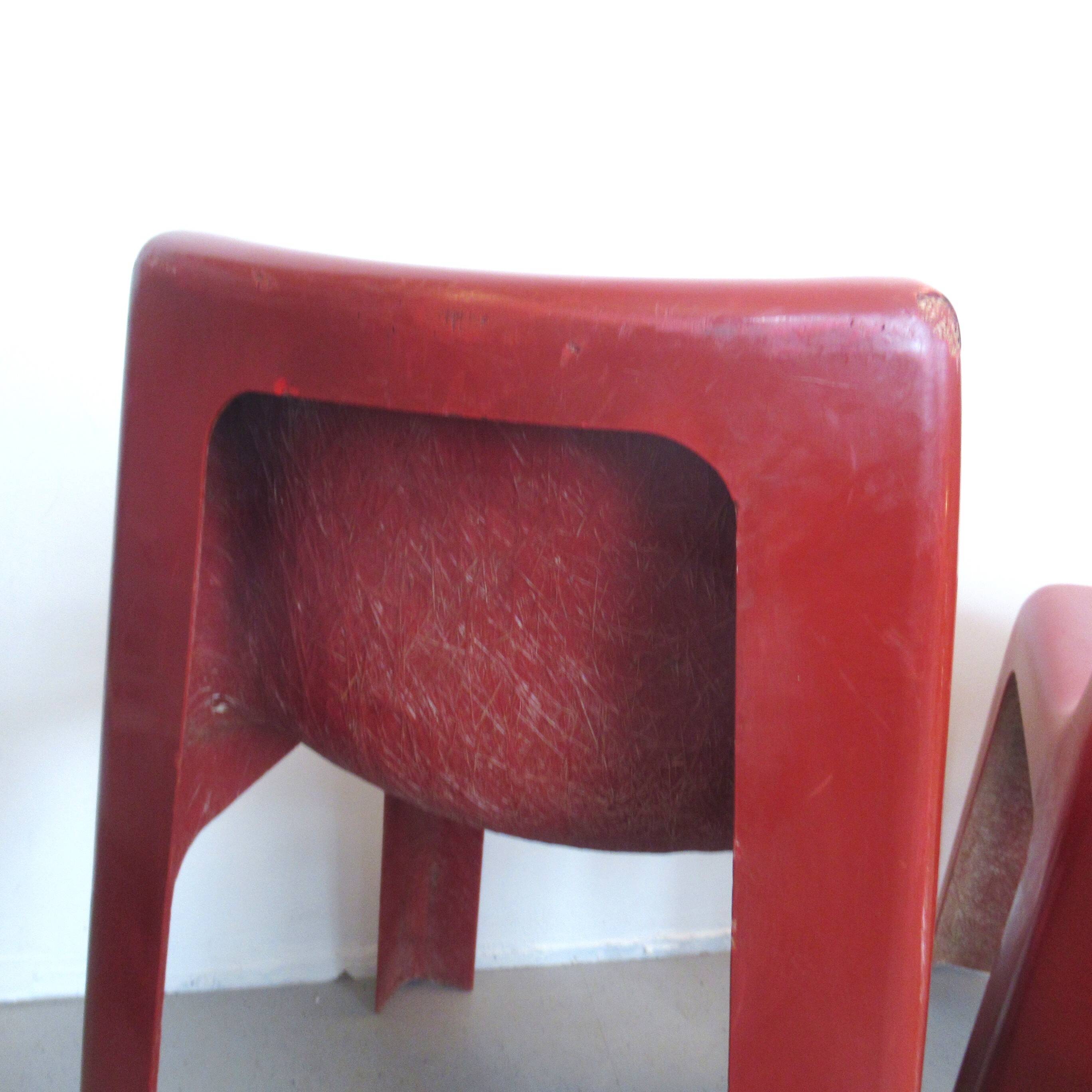 Pair of red fibreglass chairs from the 1970s.