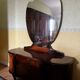 Coiffeuse art deco avec miroir biseauté de forme ovale