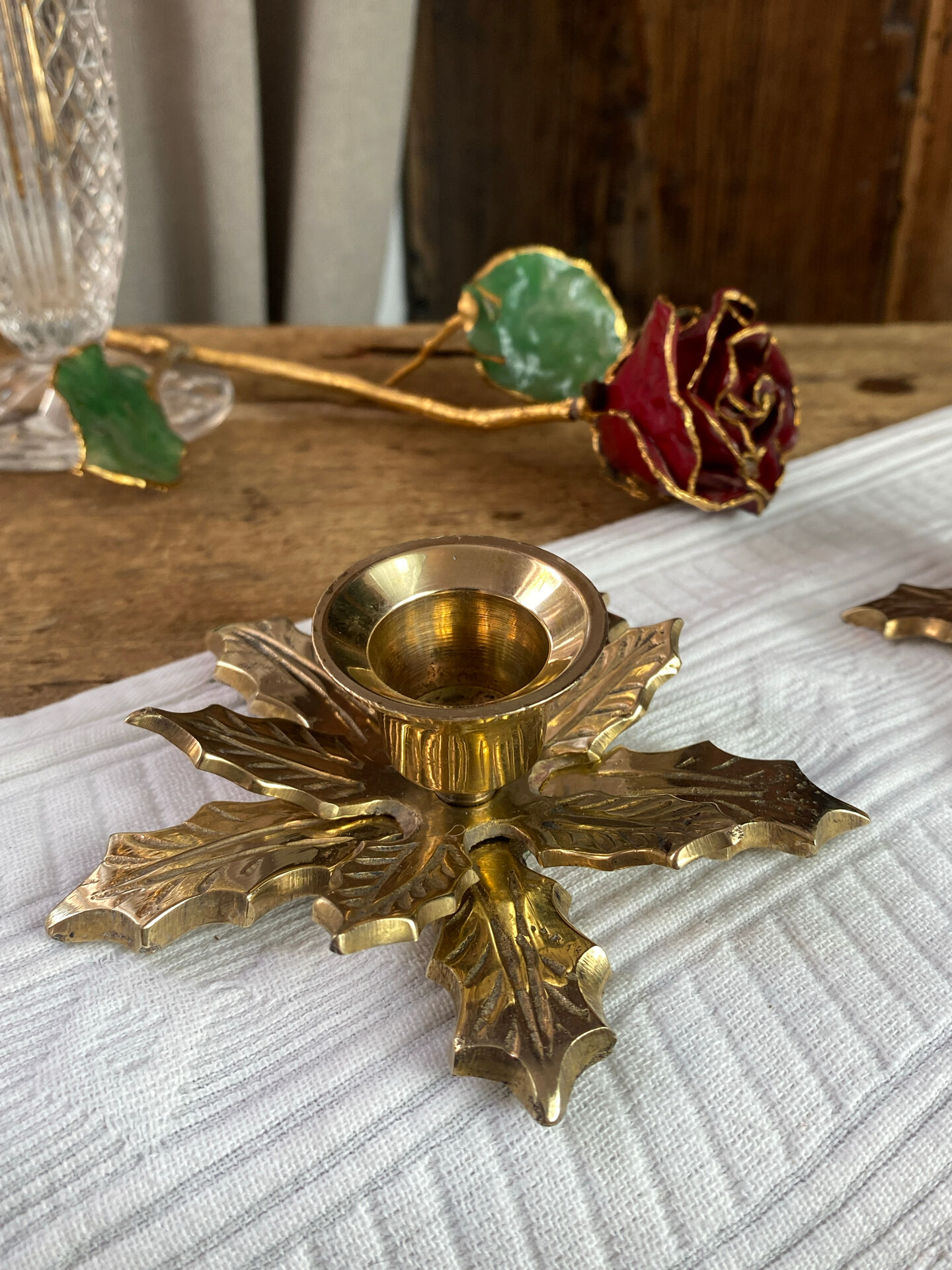 Pair of candlesticks, holly leaves, in brass