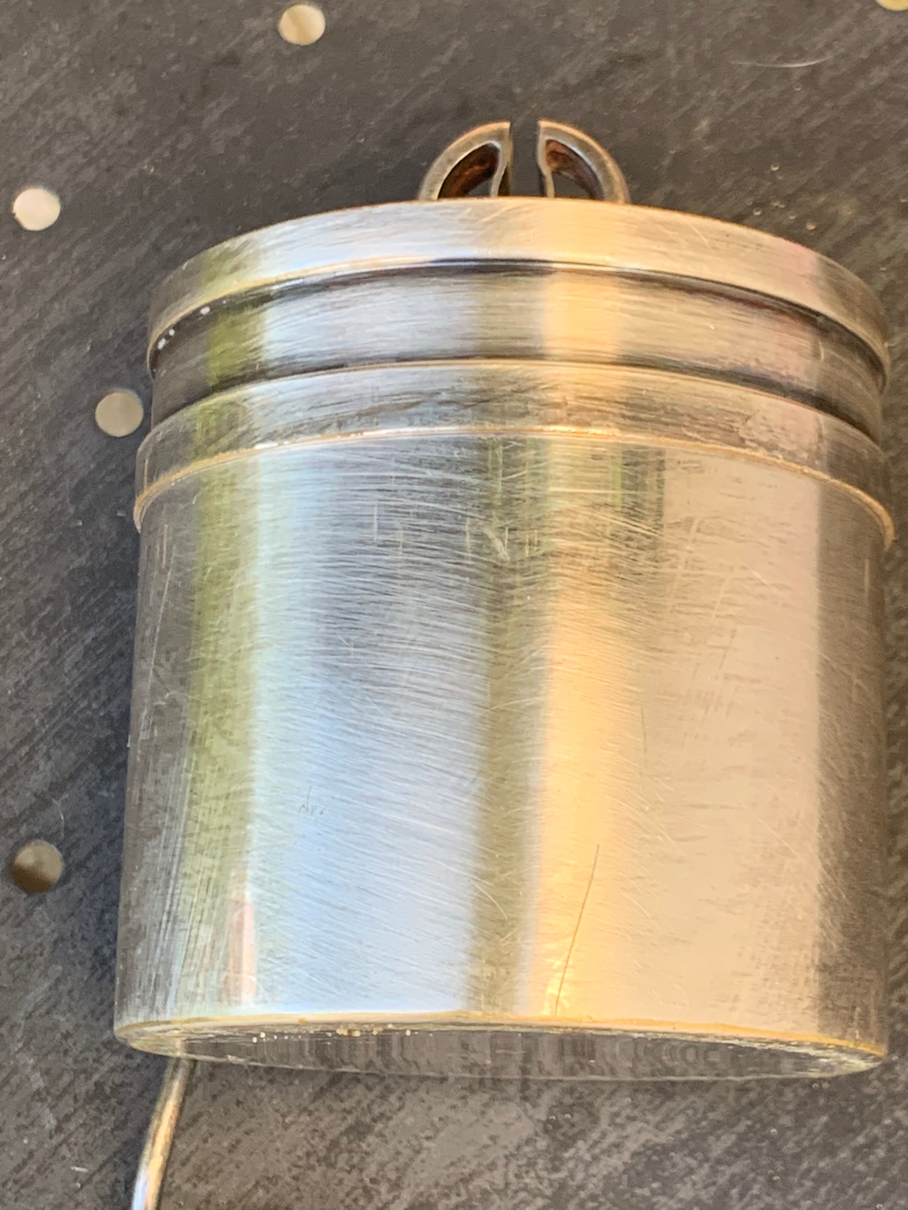 Sprinkling spoon and art deco sugar pot in silver metal