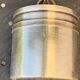 Sprinkling spoon and art deco sugar pot in silver metal