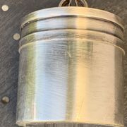 Sprinkling spoon and art deco sugar pot in silver metal