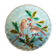 Assiette en barbotine à décor d'oiseaux