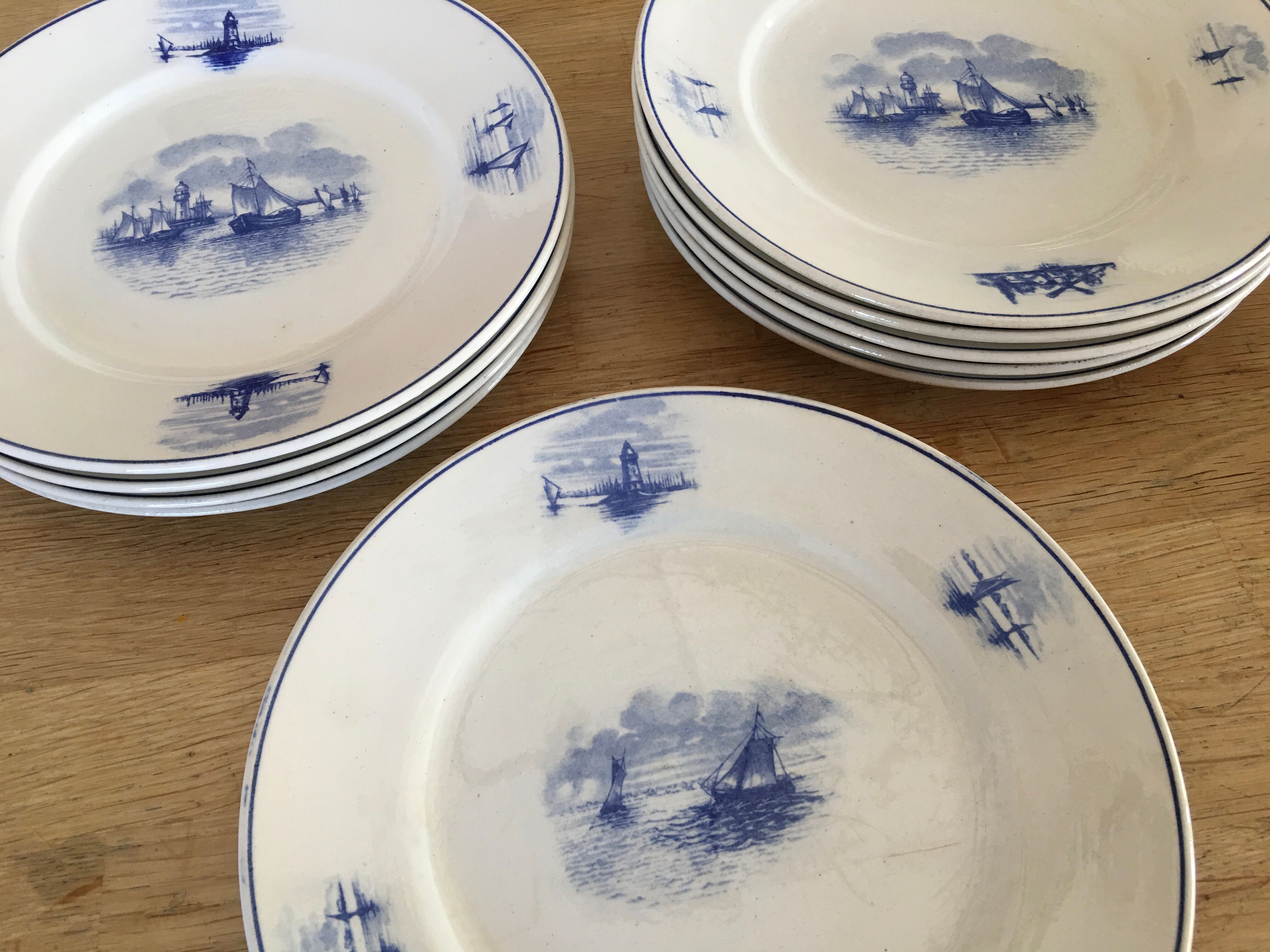 Series of 11 flat plates, Dutch earthenware, early XX